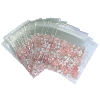 Fako Bijoux® - 100x Uitdeelzakjes - Cellofaan Plastic Traktatie Kado Zakjes - Snoepzakjes - Bloemetjes Roze/Wit - 7x7cm